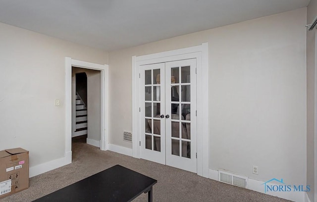 workout area with french doors and carpet floors