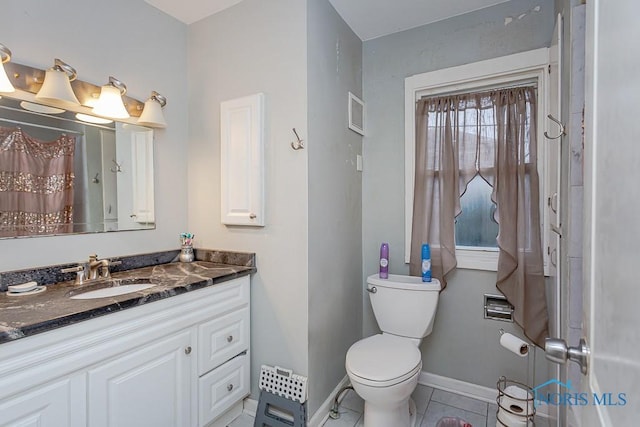 bathroom featuring vanity, a shower with shower curtain, and toilet