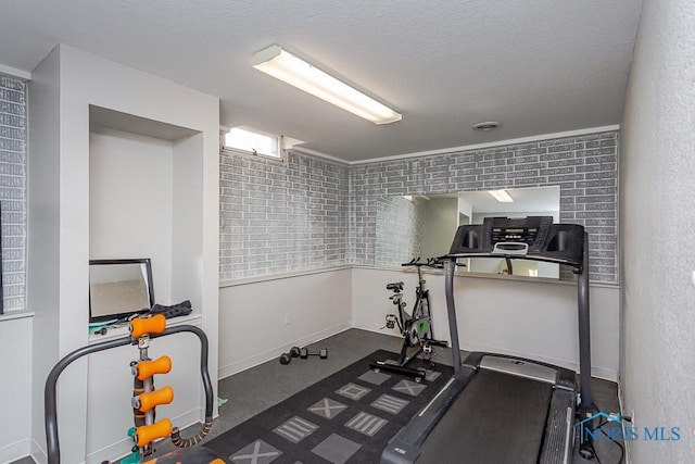 exercise area with a textured ceiling