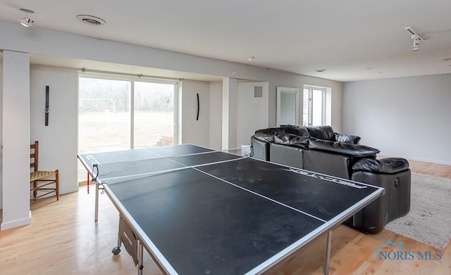 recreation room featuring hardwood / wood-style floors