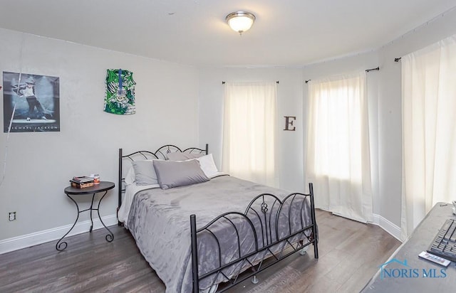 bedroom featuring dark wood-type flooring