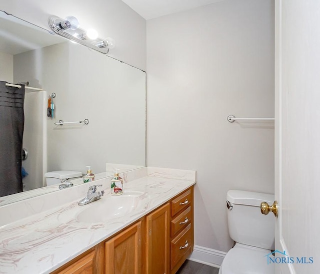 bathroom with vanity and toilet