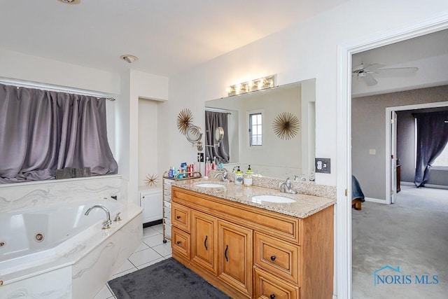 bathroom with vanity, a washtub, tile patterned flooring, and ceiling fan