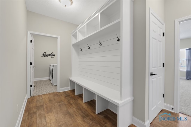 mudroom with dark hardwood / wood-style flooring