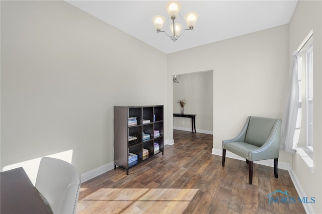 sitting room with an inviting chandelier, dark hardwood / wood-style flooring, and a wealth of natural light