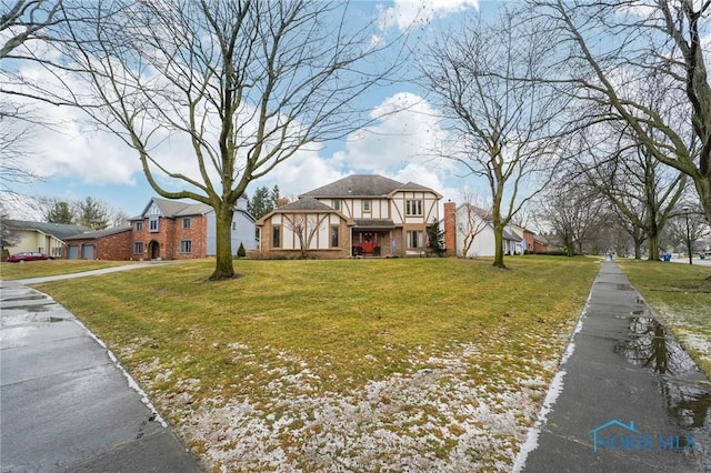 view of front of home with a front lawn