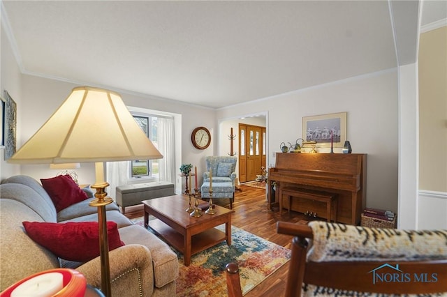 living room with hardwood / wood-style flooring and ornamental molding