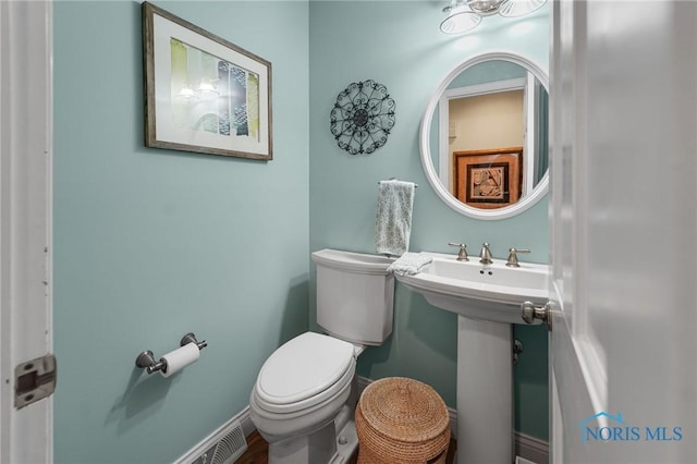 bathroom featuring sink and toilet