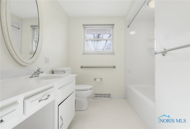 bathroom featuring toilet, vanity, visible vents, and baseboards