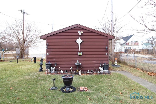 view of property exterior featuring a lawn