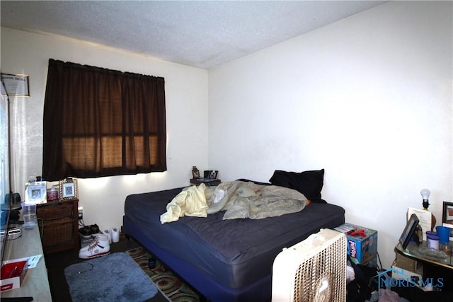 bedroom featuring a textured ceiling