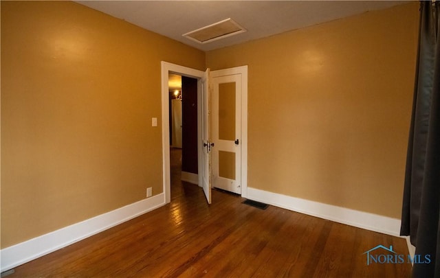 empty room featuring dark hardwood / wood-style floors