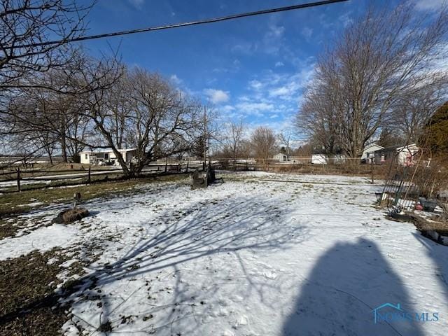 view of yard layered in snow