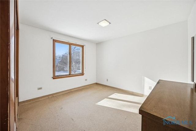 empty room featuring carpet floors