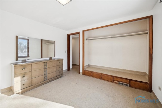 carpeted bedroom featuring a closet