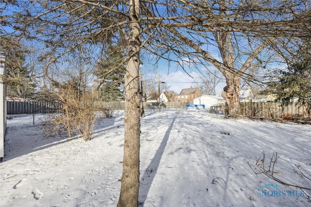 view of yard covered in snow