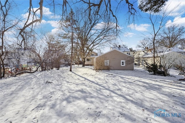 view of yard covered in snow