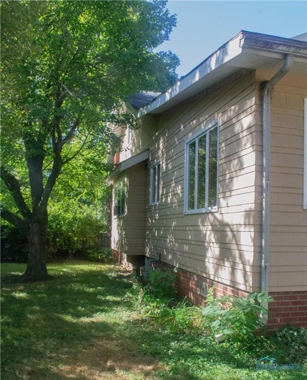 view of property exterior featuring a yard