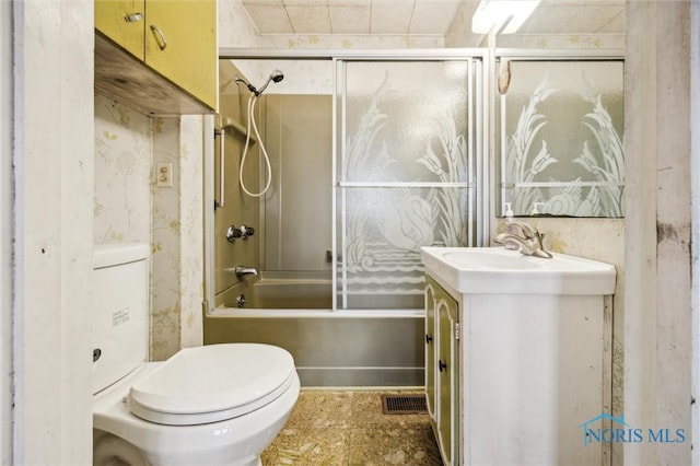 full bathroom featuring vanity, shower / washtub combination, and toilet