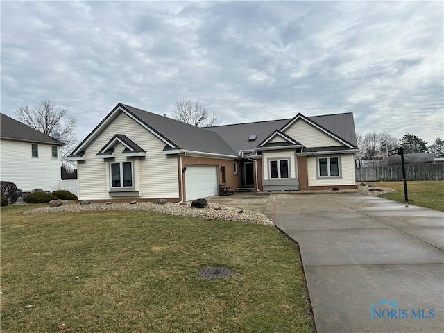 view of front of home featuring a garage and a front yard