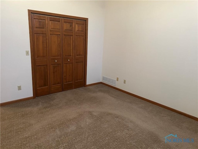 unfurnished bedroom featuring carpet