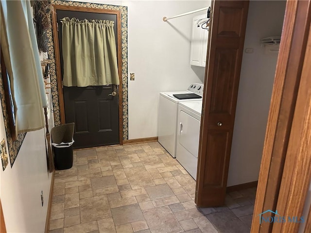 laundry area featuring cabinets and washer and dryer