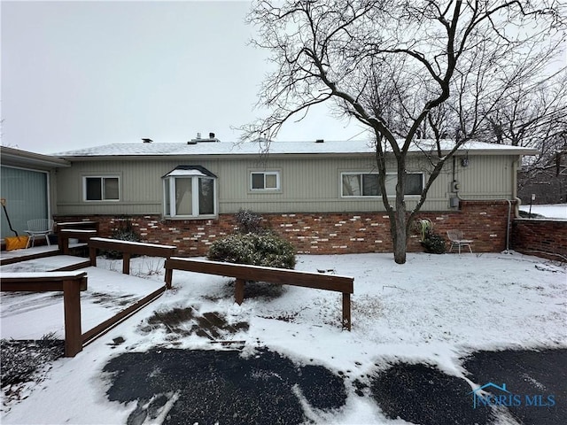 view of snow covered house