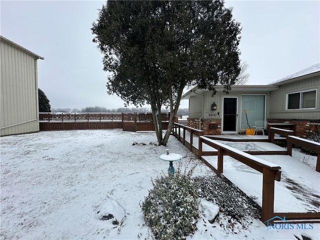 view of yard covered in snow