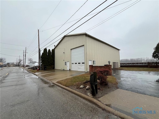 view of outbuilding featuring a garage