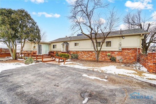 view of front of house with a wooden deck