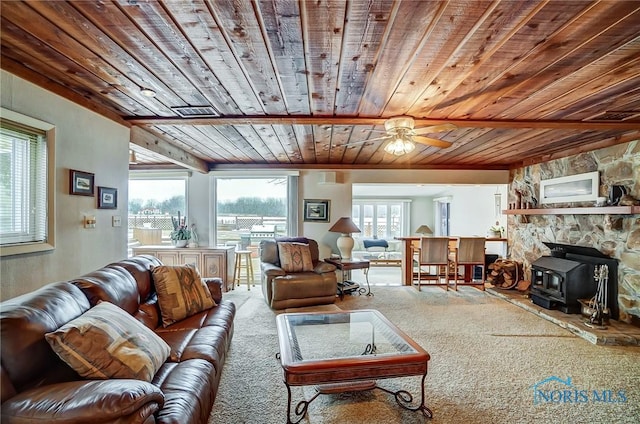 living room featuring carpet and wooden ceiling