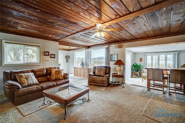 carpeted living room with wooden ceiling and ceiling fan