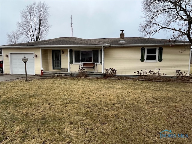 single story home featuring a garage and a front yard