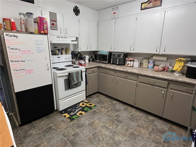 kitchen featuring stainless steel appliances, gray cabinets, and white cabinets