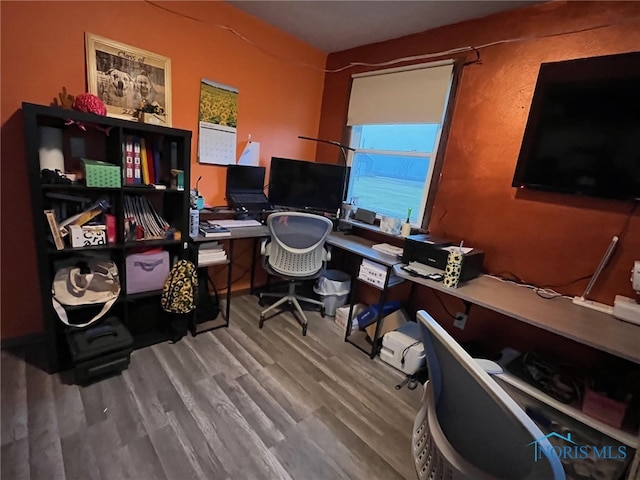 office space with wood-type flooring