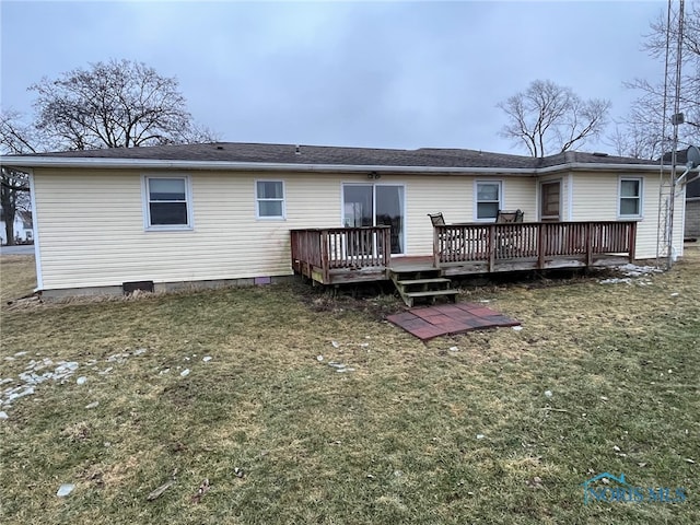 back of house with a wooden deck and a yard