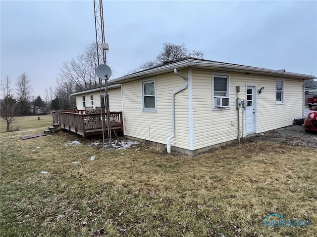 back of house with a wooden deck, a yard, and cooling unit