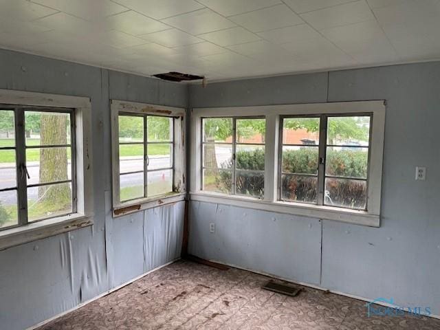 unfurnished sunroom with a healthy amount of sunlight