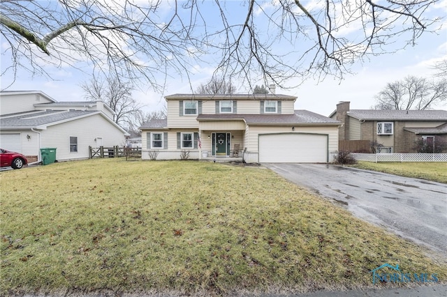 view of front property with a garage and a front yard