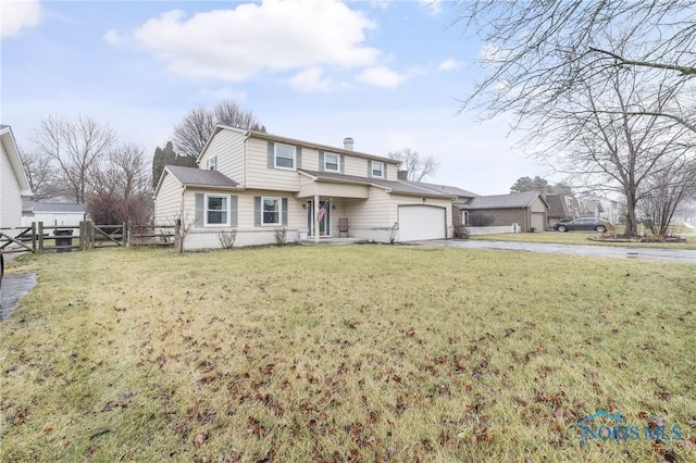 front facade with a garage and a front lawn