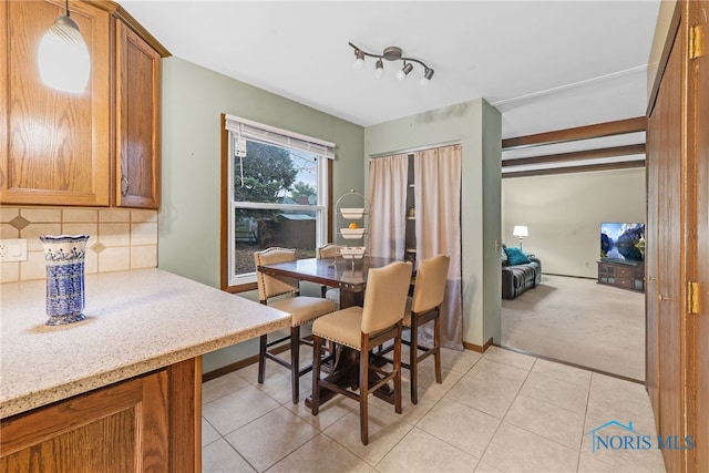 dining space featuring light tile patterned floors