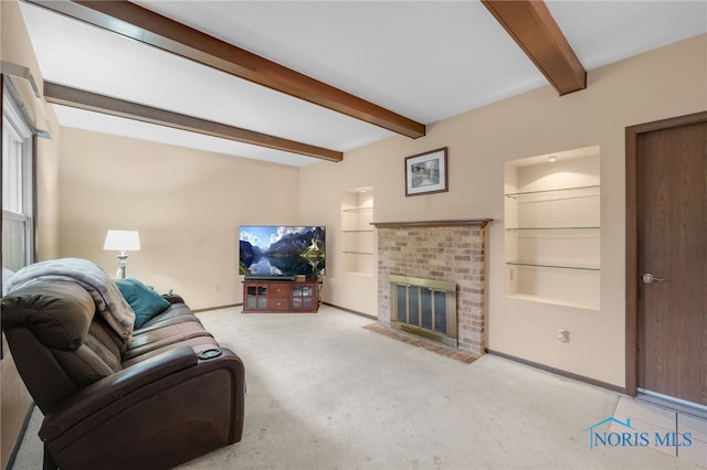 living room featuring beamed ceiling, light colored carpet, a fireplace, and built in shelves