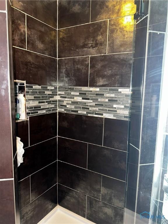 room details with a tile shower