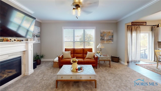 living room with crown molding and light colored carpet