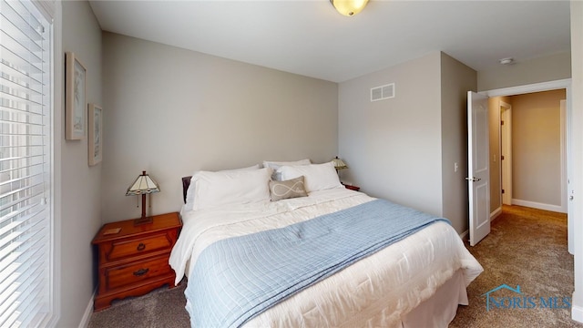 bedroom featuring carpet