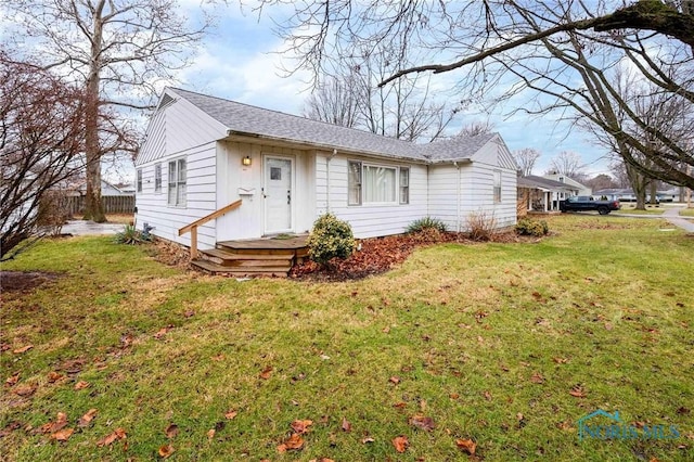 ranch-style house featuring a front lawn