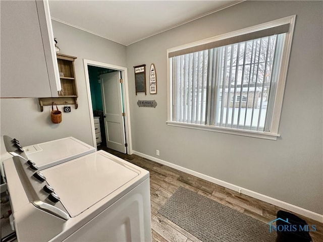 laundry room featuring dark wood-type flooring and independent washer and dryer