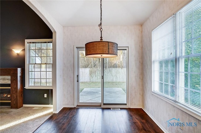 entryway with dark hardwood / wood-style flooring