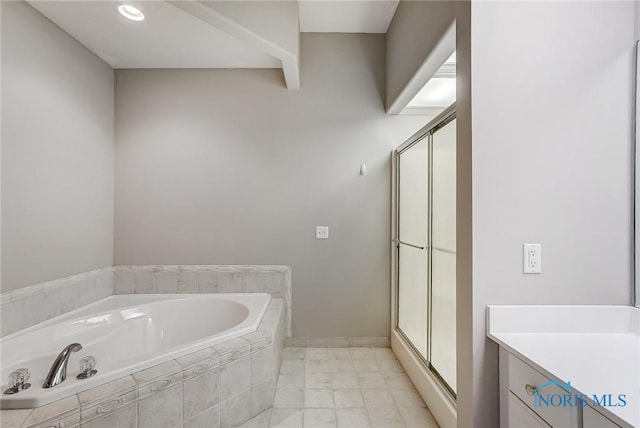 bathroom with vanity and separate shower and tub