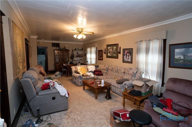 living room with crown molding, ceiling fan, and carpet flooring